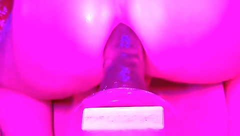 Busty girl is playing around with her bbc in a fetish film