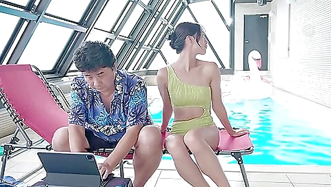 Asian girl gives a hot and kinky anal sex in the resort pool